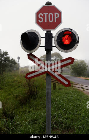 STOP signage with red light flashing, yellow school bus at the ...
