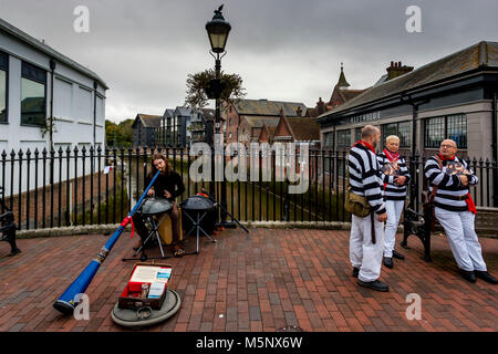 A Man Playing A Didgeridoo In The High Street, Lewes, Sussex, UK Stock Photo