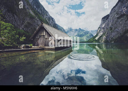 Beautiful view of traditional wooden boat house at the shores of famous Lake Obersee in Nationalpark Berchtesgadener Land in summer, Bavaria. Germany