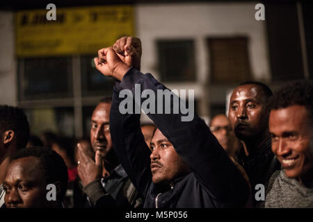 Tel Aviv, Israel. 24th Feb, 2018. An asylum seeker makes handcuffed gestures during a protest against deportation in Tel Aviv, Israel, 24 February 2018. Israel considers the vast majority of the nearly 40,000 migrants to be job seekers and says that it has no legal obligation to keep them. Credit: Ilia Yefimovich/dpa/Alamy Live News Stock Photo