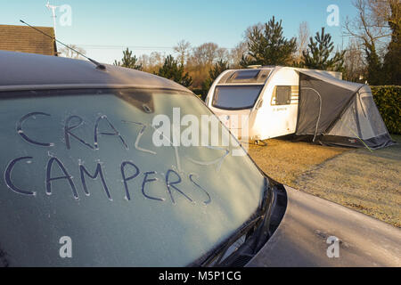 Henlow Bridge Lakes, Bedfordshire, UK, 25th February 2018. Caravaners brave the extreme winter temperatures at a campsite in Southern England as the thermometer drops to minus 5 degrees Celsius and the icy weather continues for the next few days. Credit: Mick Flynn/Alamy Live News Stock Photo