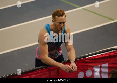 Glasgow, Scotland, 25 February 2018. Greg Rutherford talking to his coach during the long jump at the Muller Indoor Grand Prix in Glasgow.  Credit: Colin Edwards/Alamy Live News. Stock Photo