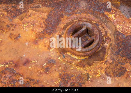 Rosneft engineering lube oil barrel washed up on a Cornwall beach. Abstract oil industry, rusty metal texture, industrial background metal texture Stock Photo