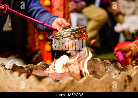 Yagya a fire flame ritual of hindu pooja performing during wedding ceremony Stock Photo