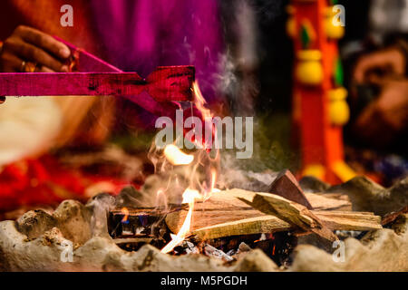 Yagya a fire flame ritual of hindu pooja performating during wedding ceremony Stock Photo