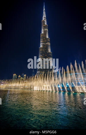 Water fountains infront of the impressive Burj Khalifa in Dubai at Night Stock Photo
