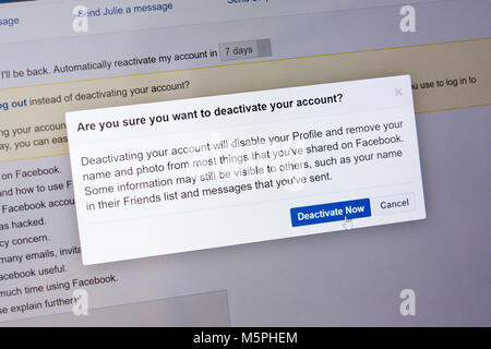 Quitting Facebook dialogue box with mouse hovering over deactivate your account now button on computer screen, UK. Concept - social media addiction Stock Photo