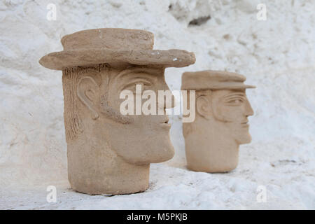 Granada, Spain: A pair of rustic pottery busts of Gypsy men at the Cuevas del Sacromonte Museum in the Barrio Albaicín. Stock Photo