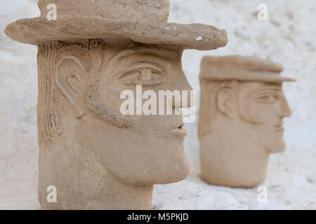 Granada, Spain: A pair of rustic pottery busts of Gypsy men at the Cuevas del Sacromonte Museum in the Barrio Albaicín. Stock Photo