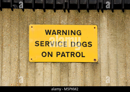 Warning service dogs on patrol sign Hyde Park Barracks located in Knightsbridge in central London, on the southern edge of Hyde Park Stock Photo