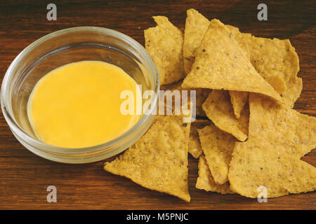 Top view of nachos with cheese dip. Unhealthy food concept Stock Photo