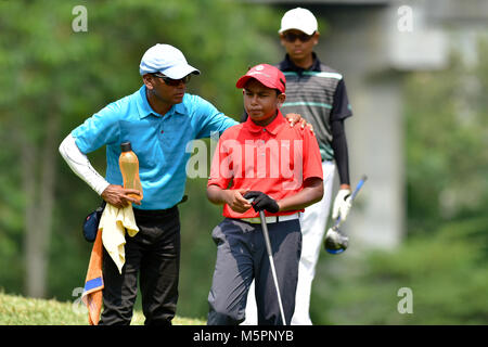 Danau, UKM Bangi - FEBRUARY 11: Basil Devanbu talks to his caddie the 5th hole during Final Round of the Danau Junior Championship at Danau Golf Club  Stock Photo