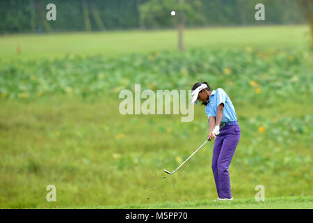 Danau, UKM Bangi - FEBRUARY 11: Divyasheni Gunasegar plays her shots on the 15th hole during Final Round of the Danau Junior Championship at Danau Gol Stock Photo