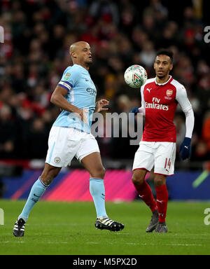 Manchester City's Vincent Kompany (left) and Arsenal's Pierre-Emerick Aubameyang (right) during the Carabao Cup Final at Wembley Stadium, London. Stock Photo