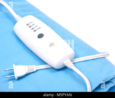 Blue electric heating pad isolated on white background Stock Photo