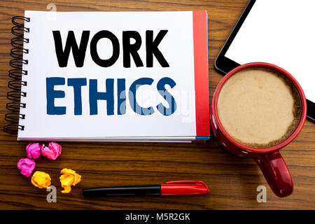 Handwritten text showing Work Ethics. Business concept writing Moral Benefit Principles Written on notepad paper, old black wooden background in offic Stock Photo