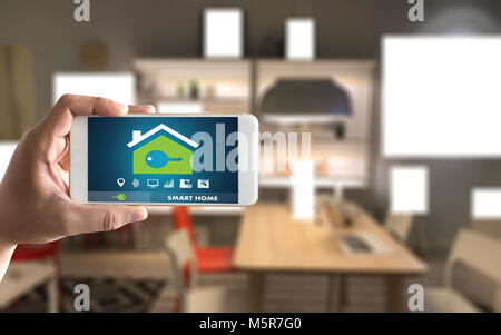 Internet of things   iot  Remote home control to modern living room system on phone Stock Photo