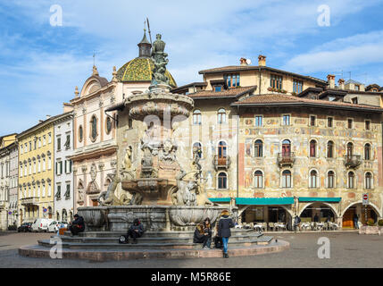 Duomo square with the Fountain of Nettuno, on the background the historical palaces , Trento, Trentino Alto Adige, northern italy Stock Photo