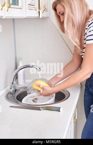 women hends washing dishes in the kitchen ,close up Stock Photo