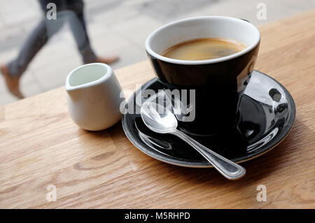 cup of americano coffee on cafe table, norwich, norfolk, england Stock Photo