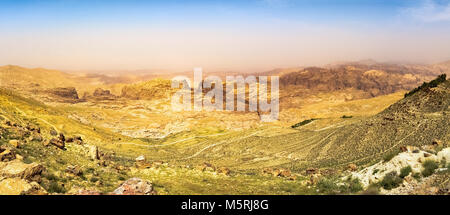 Travel to Middle East country Kingdom of Jordan - blue sky over mountain around Wadi Araba (Arabah, Arava, Aravah) area near Petra town in sunny sprin Stock Photo