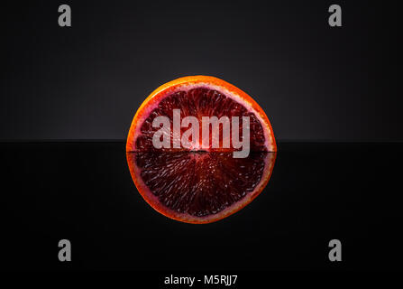Half blood orange on clipping path black background Stock Photo