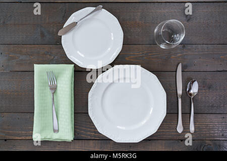 Dining place setting on a rustic wood background Stock Photo