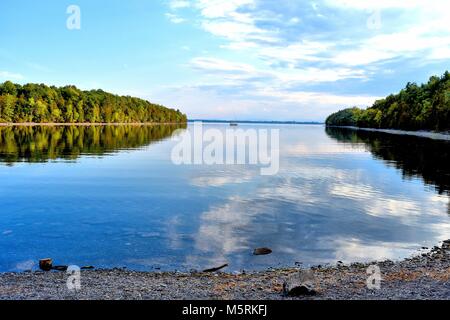 A calm bay stretches between two peninsulas in Point Au Roche State Park on Lake Champlain, in New York. Stock Photo