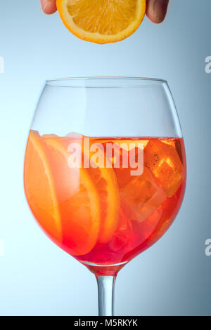 Summer refreshing faintly alcoholic cocktail Aperol spritz in a  Stock Photo
