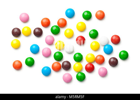Colorful chocolate candy pills isolated on white background. Top view Stock Photo