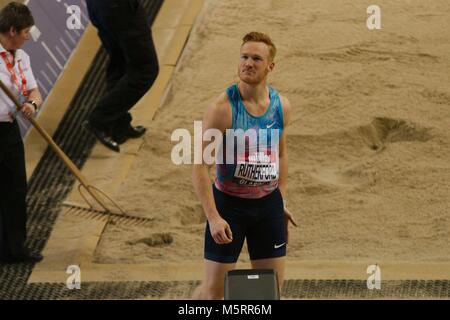 Glasgow, Scotland, 25 February 2018. Greg Rutherford checks the big screen after jumping in the long jump at the Muller Indoor Games in Glasgow. Credit: Colin Edwards/Alamy Live News. Stock Photo