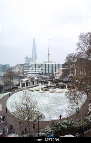 London, United Kingdom. 26th Feb, 2018. UK Weather: Fresh snow fall in the park in front of The Shard London, United Kingdom. Credit: Yuhe Lim/Alamy Live News. Stock Photo
