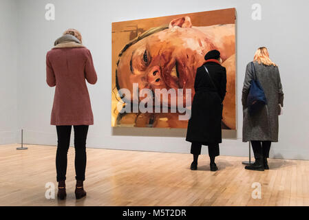 London, UK.  26 February 2018. Visitors view 'Reverse', 2002-3, by Jenny Saville.  Preview of 'All Too Human', an exhibition at Tate Britain which explores how artists in Britain have stretched the possibilities of paint in order to capture life around them.  The exhibition runs 28 February to 27 August 2018 and includes rarely seen works by Lucian Freud and Francis Bacon.  Credit: Stephen Chung / Alamy Live News Stock Photo