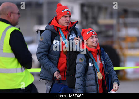 26 February 2018, Germany, Frankfurt am Main: The figure skating couple Aljona Savchenko (R-L) and Bruno Massot walks across the runway after the landing of the Lufthansa aircraft LH713 with more than 150 other athletes, coaches and officials on board. Photo: Arne Dedert/dpa Stock Photo