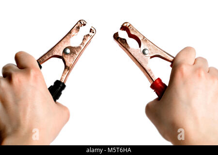 battery jumper cables in hands, on white background Stock Photo