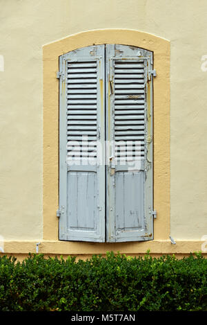Shutters in front of the window Stock Photo