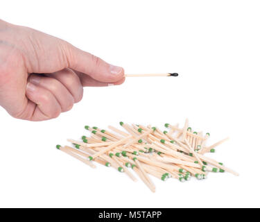 Young woman holding match stick over sulfur free matches separated on white background Stock Photo