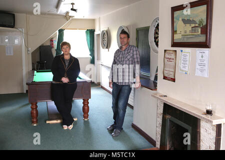 Aidan O'Toole a  survivor of the 1994 gun attack, and Emma Rogan the daughter of Adrian Rogan a victim who was murdered by Loyalist gunmen in 1994 attack stand inside the same room where the gun attack took place in the Bar as it is today. (2 Oct 2012). Aidan O'Toole stands in the same spot where he was on the night of the gun attack. Once the main Bar area, today, the room has been turned into a loung and pool room.  O'Tooles Bar is the only Bar in the small village of Loughinisland in County Down, Northern Ireland. On 18 June 1994 and Stock Photo