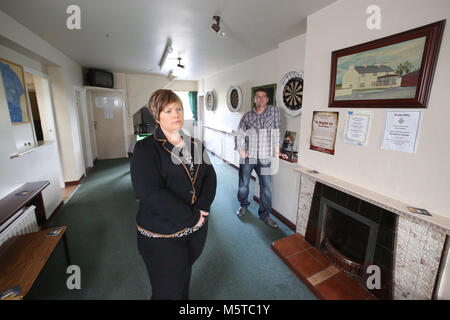 Aidan O'Toole a  survivor of the 1994 gun attack, and Emma Rogan the daughter of Adrian Rogan a victim who was murdered by Loyalist gunmen in 1994 attack stand inside the same room where the gun attack took place in the Bar as it is today. (2 Oct 2012). Aidan O'Toole stands in the same spot where he was on the night of the gun attack. Once the main Bar area, today, the room has been turned into a loung and pool room.  O'Tooles Bar is the only Bar in the small village of Loughinisland in County Down, Northern Ireland. On 18 June 1994 and Stock Photo