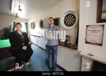 Aidan O'Toole a  survivor of the 1994 gun attack, and Emma Rogan the daughter of Adrian Rogan a victim who was murdered by Loyalist gunmen in 1994 attack stand inside the same room where the gun attack took place in the Bar as it is today. (2 Oct 2012). Aidan O'Toole stands in the same spot where he was on the night of the gun attack. Once the main Bar area, today, the room has been turned into a loung and pool room.  O'Tooles Bar is the only Bar in the small village of Loughinisland in County Down, Northern Ireland. On 18 June 1994 and Stock Photo