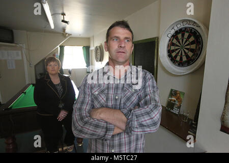 Aidan O'Toole a  survivor of the 1994 gun attack, and Emma Rogan the daughter of Adrian Rogan a victim who was murdered by Loyalist gunmen in 1994 attack stand inside the same room where the gun attack took place in the Bar as it is today. (2 Oct 2012). Once the main Bar area, today, the room has been turned into a loung and pool room.  O'Tooles Bar is the only Bar in the small village of Loughinisland in County Down, Northern Ireland. On 18 June 1994 and The Ulster Volunteer Force (UVF), a loyalist paramilitary group, attacked the crowd Stock Photo