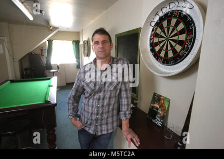 Aidan O'Toole a  survivor of the 1994 gun attack by Loyalist gunmen in 1994 attack stand inside the same room where the gun attack took place in the Bar as it is today. (2 Oct 2012). Aidan O'Toole stands in the same spot where he was on the night of the gun attack. Once the main Bar area, today, the room has been turned into a loung and pool room.  O'Tooles Bar is the only Bar in the small village of Loughinisland in County Down, Northern Ireland. On 18 June 1994 and The Ulster Volunteer Force (UVF), a loyalist paramilitary group, attack Stock Photo