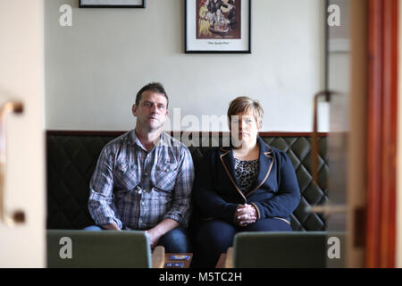 Aidan O'Toole a  survivor of the 1994 gun attack, and Emma Rogan the daughter of Adrian Rogan a victim who was murdered by Loyalist gunmen in 1994 attack sit inside the same room where the gun attack took place in the Bar as it is today. (2 Oct 2012). O'Tooles Bar is the only Pub in the small village of Loughinisland in County Down, Northern Ireland. On 18 June 1994 and The Ulster Volunteer Force (UVF), a loyalist paramilitary group, attacked the crowded pub with assault rifles killing six civilians and wounding five. The pub was targete Stock Photo