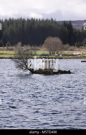 Wee House or Broons house on small island in Loch Shin  Lairg Scotland March 2012 Stock Photo