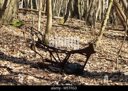 Burnt out motorcycle chassis in Cobham Woods, Kent, UK Stock Photo