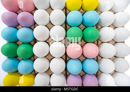 Colorful eggs in egg crate, flat lay view on a wide angle Stock Photo