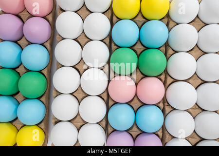 Easter egg festive background: different colored eggs on a table top Stock Photo