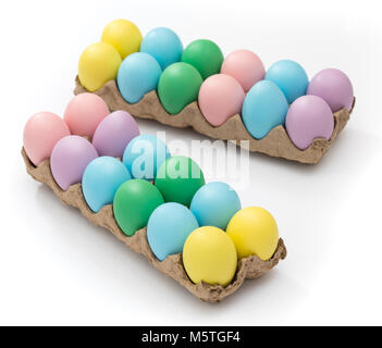 Vibrant Easter eggs in a crate on a seamless white background Stock Photo