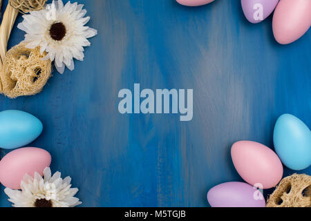 Beautiful Easter composition: colorful dyed eggs on a dark blue background Stock Photo