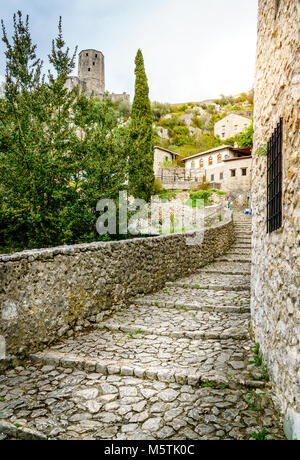 Medieval cobblestone street in a small Bosnian town of Pocitelj Stock Photo